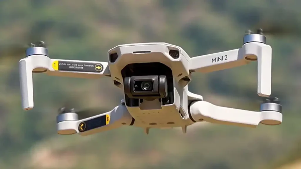 A DJI Mini 2 drone flying in the sky